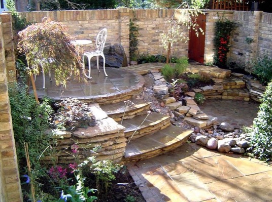 Ornate Romantic Patio With Flowers And Flagstone