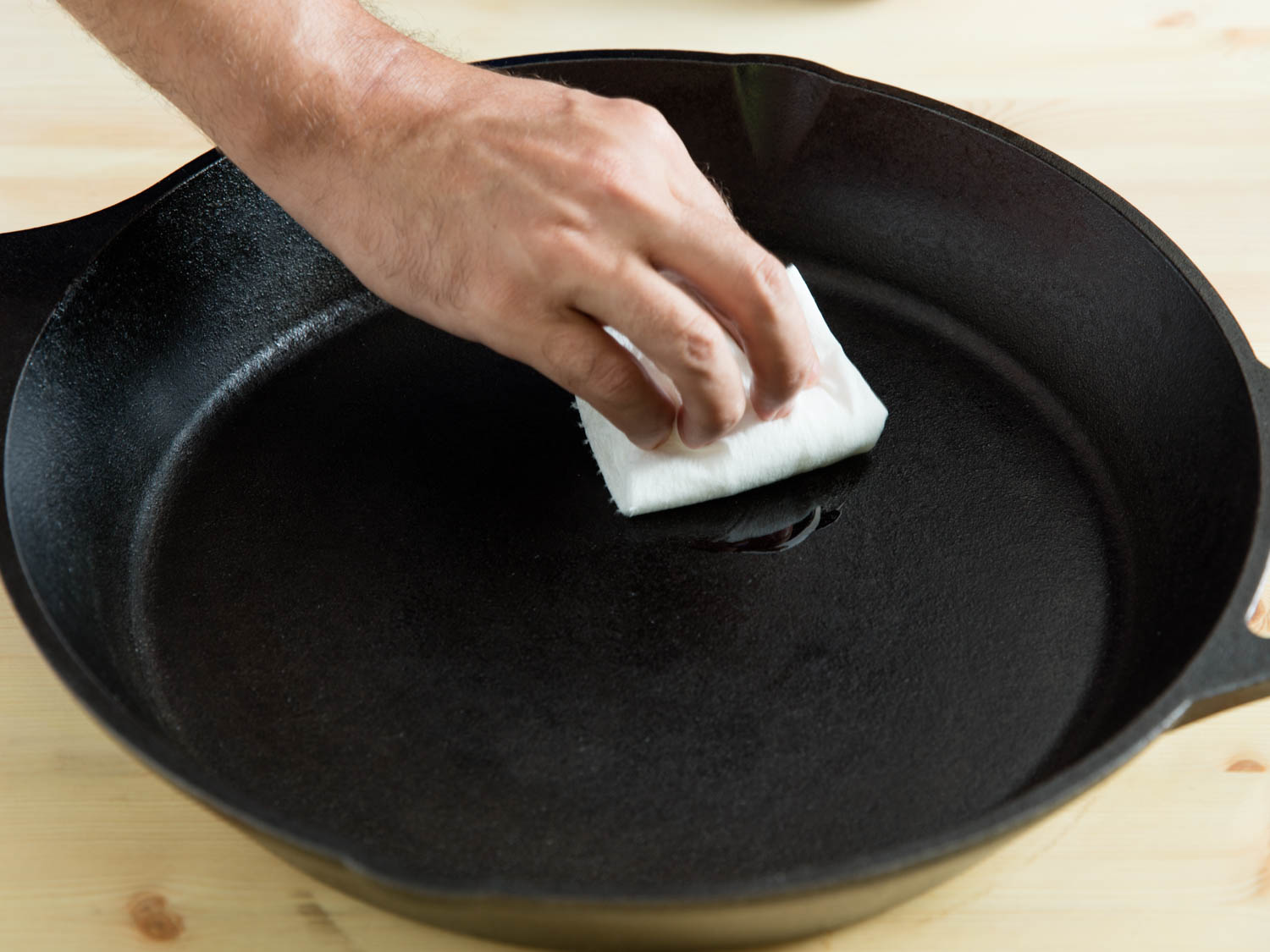 Seasoning is simply covering the cast iron in a protective coating