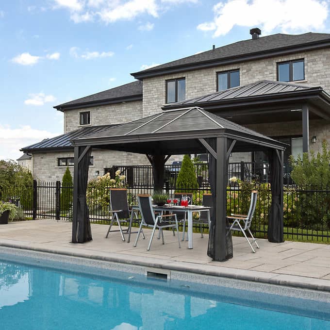 An Example of Sojag Mykonos Double Roof Hardtop Gazebo as an outdoor shelter